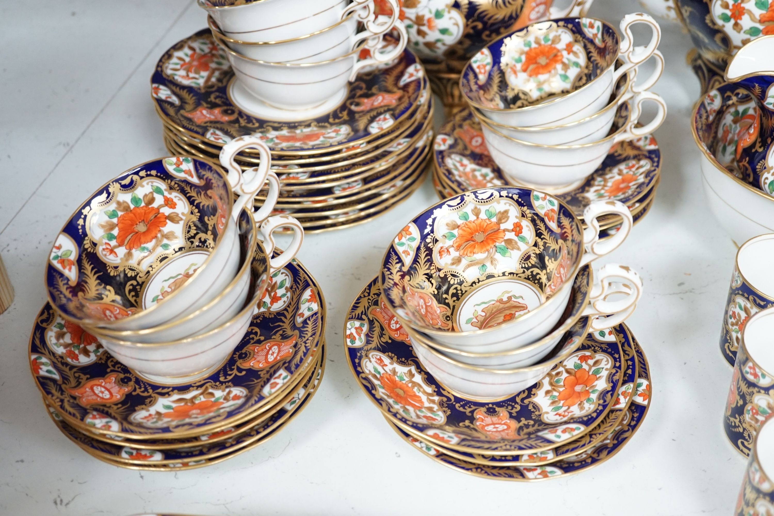A mid 19th century English bone china fifty-two piece part tea and coffee service, decorated in an Imari pattern